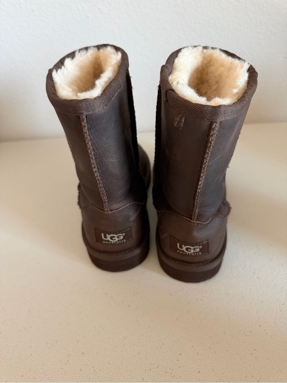 UGG Classic Short boots feature a warm shearling lining and durable textured rub